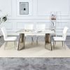 Table and chair set.63"x31.5x30" Luxurious Pandora patterned Sintered Stone Tabletop with Silver Stainless Steel Legs.Paried With 4 White PU Chairs wi